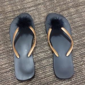 Foam flip flops with pom pom